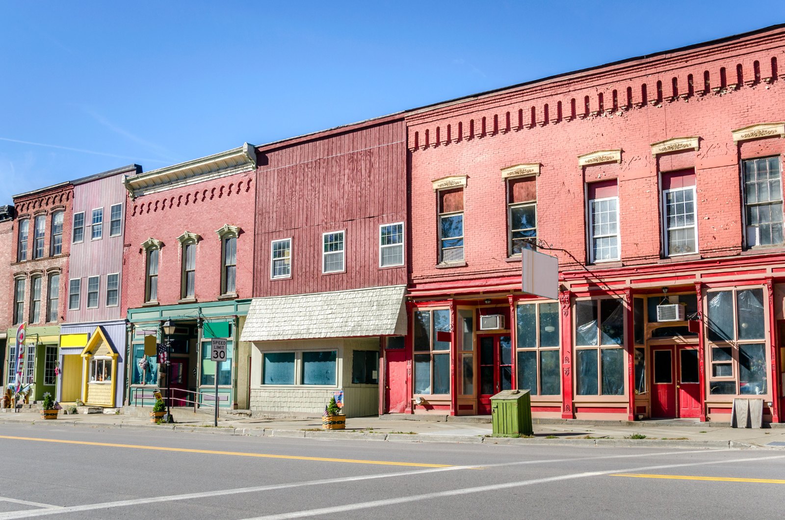 Historic storefronts on a hillside main street, one of the classic things to do in Northwest Arkansas